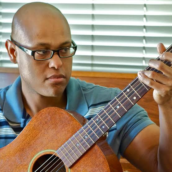 Josh Dukes playing guitar