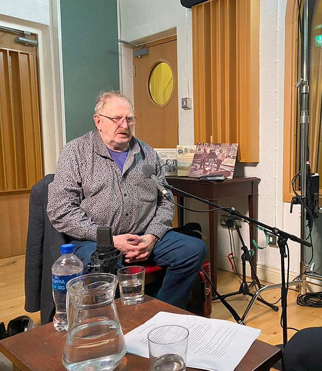 Paddy O'Brien seated in the ITMA studio
