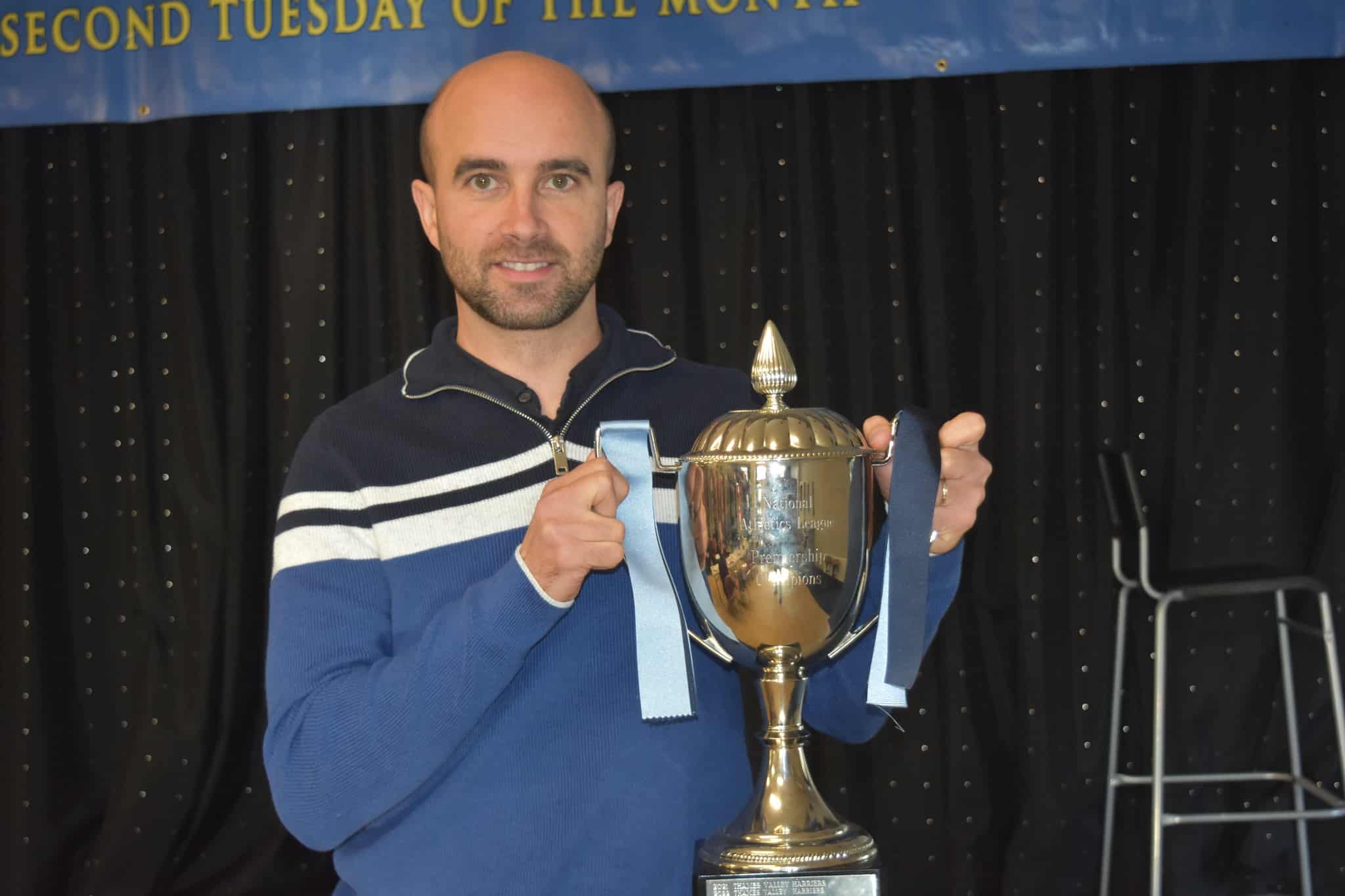 Team manager Manuel da Silva receives the NAL Premiership trophy 