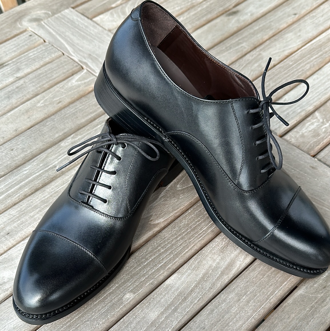 product/1727986389724_Mensblackcaptoefront.jpg
