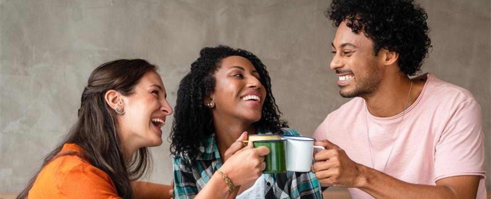 Friends having a hot drink together