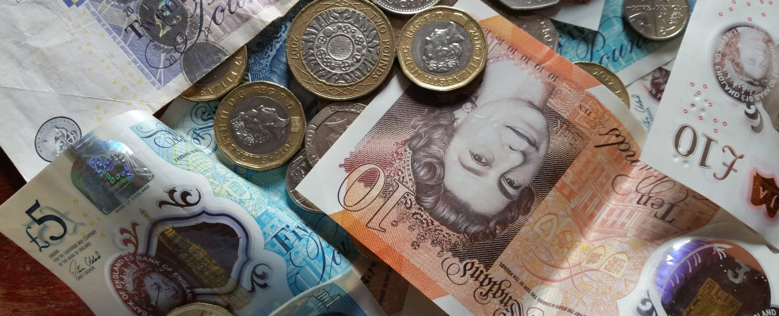 Pound coins and notes money