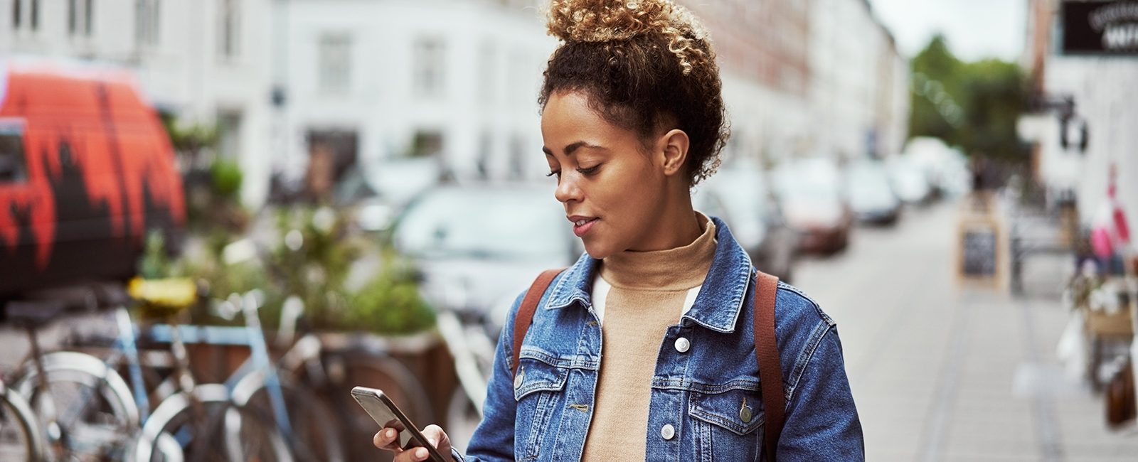 Stock woman using map mobile