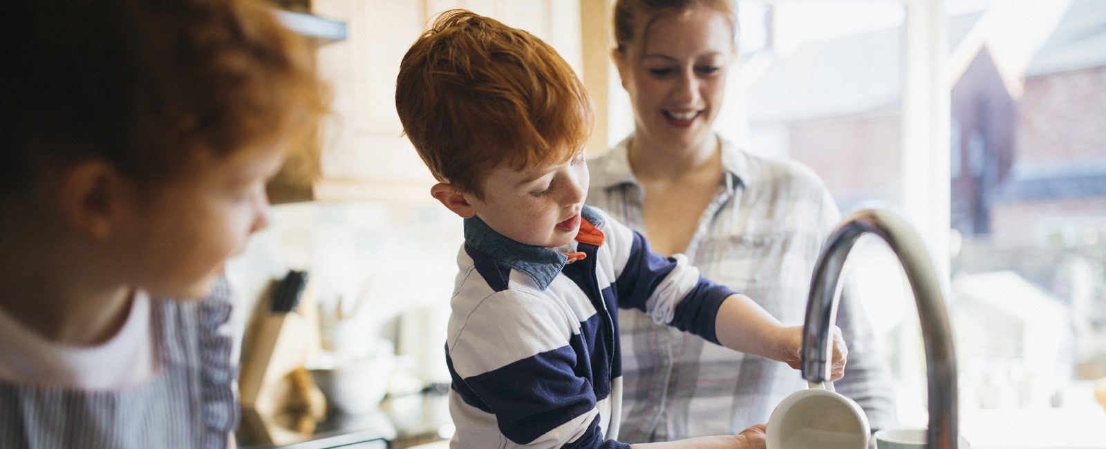 Stock kids helping in kitchen