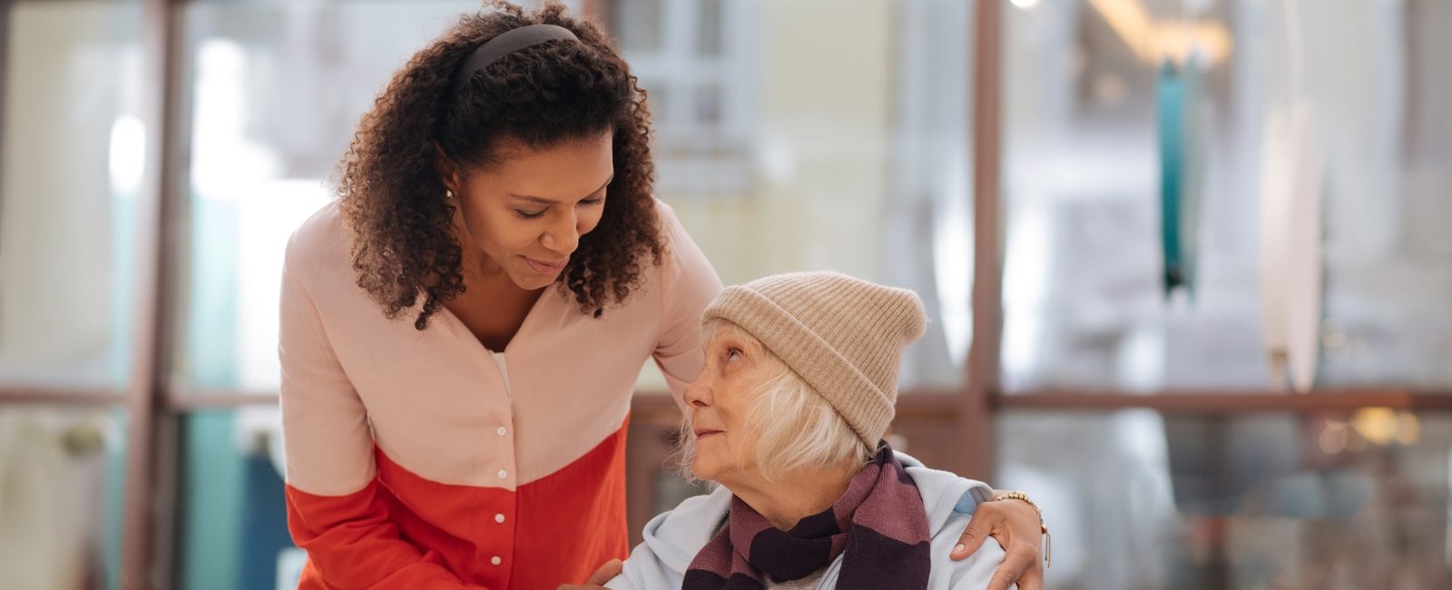 Stock woman helping older woman