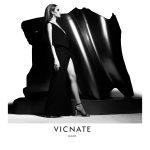 Eku Edewor stands in front of an Ugo Akwikwu sculpture for the Vicnate N°4 campaign