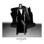 Eku Edewor stands in front of an Ugo Akwikwu sculpture for the Vicnate N°4 campaign