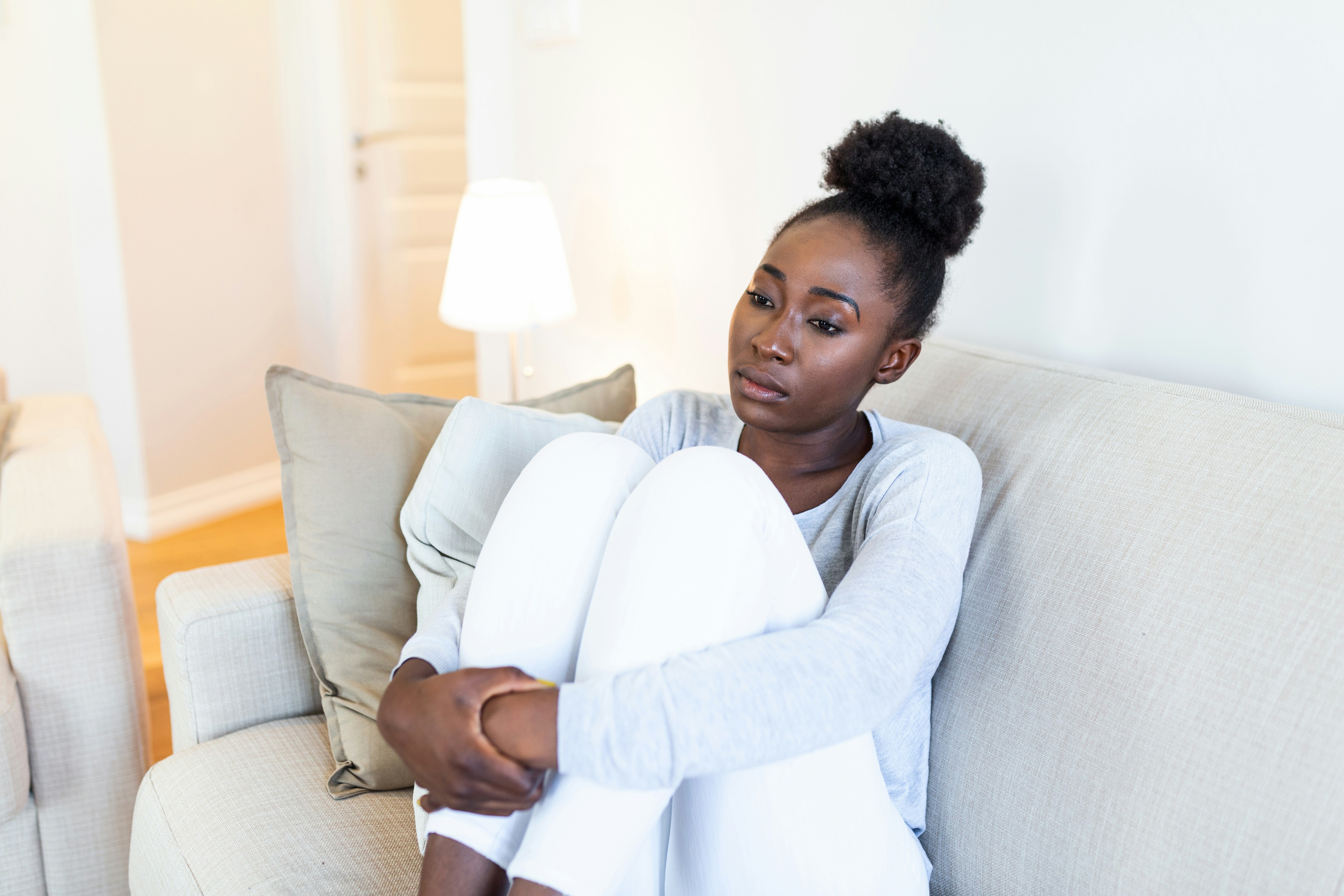 A black woman holding herself together by Getty Images via Unsplash