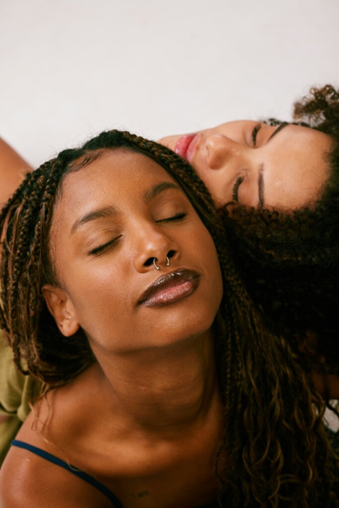 Black women posing by Natalia Blauth via Unsplash