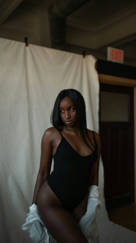 Black woman posing by Jayson Hinrichsen via Unsplash
