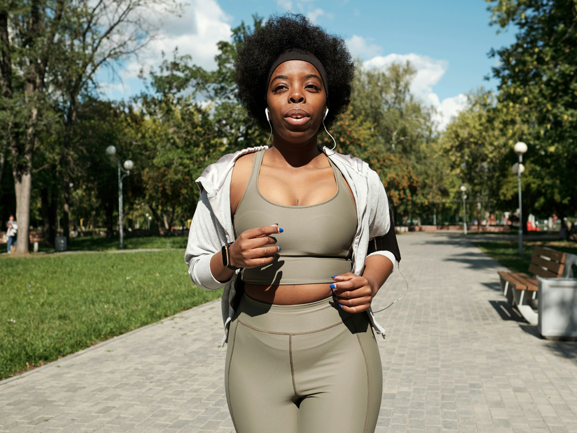 10000 steps: A black woman power-walking via Getty Images on Unsplash+