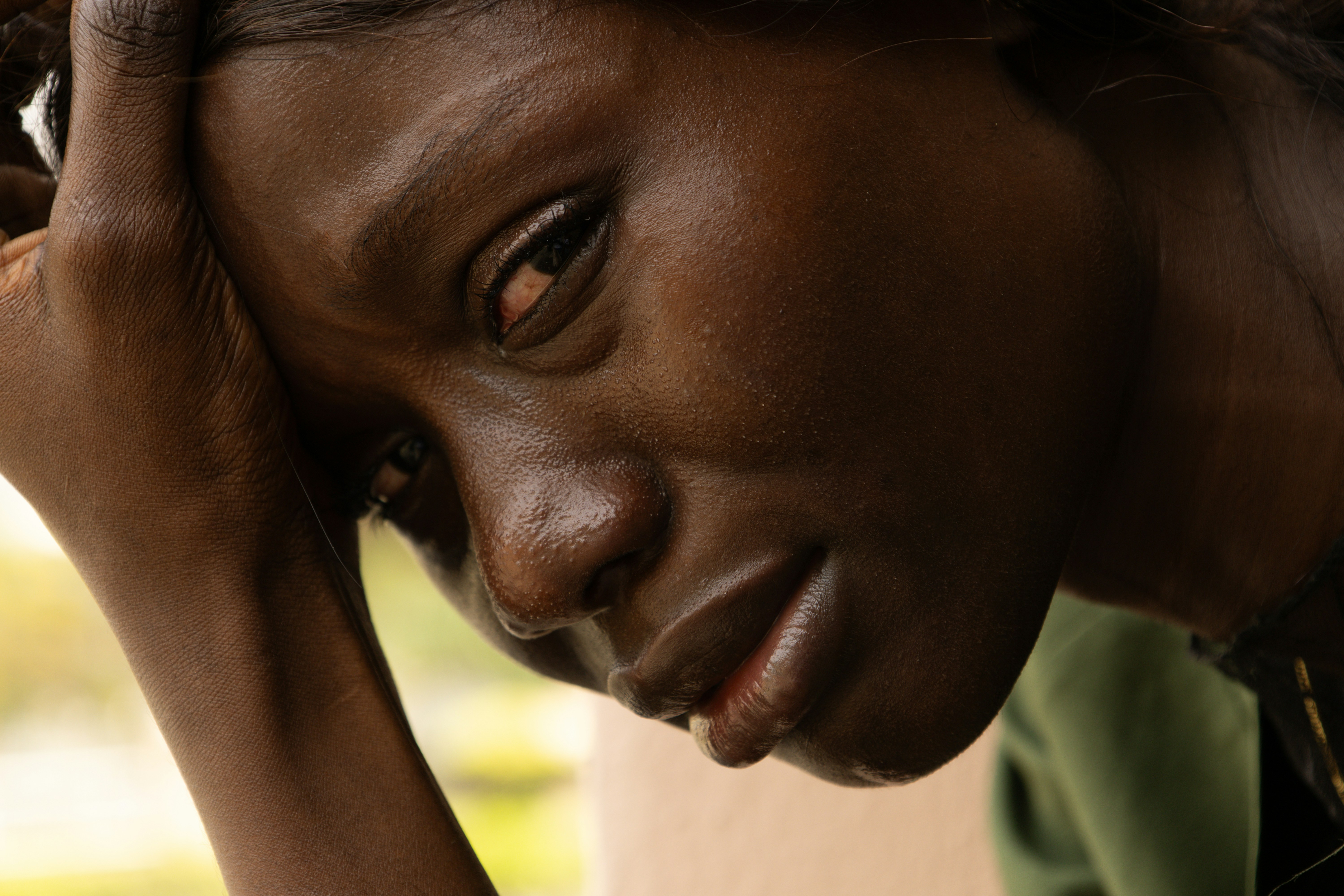 Black woman in distress by Ben Iwara via Unsplash+