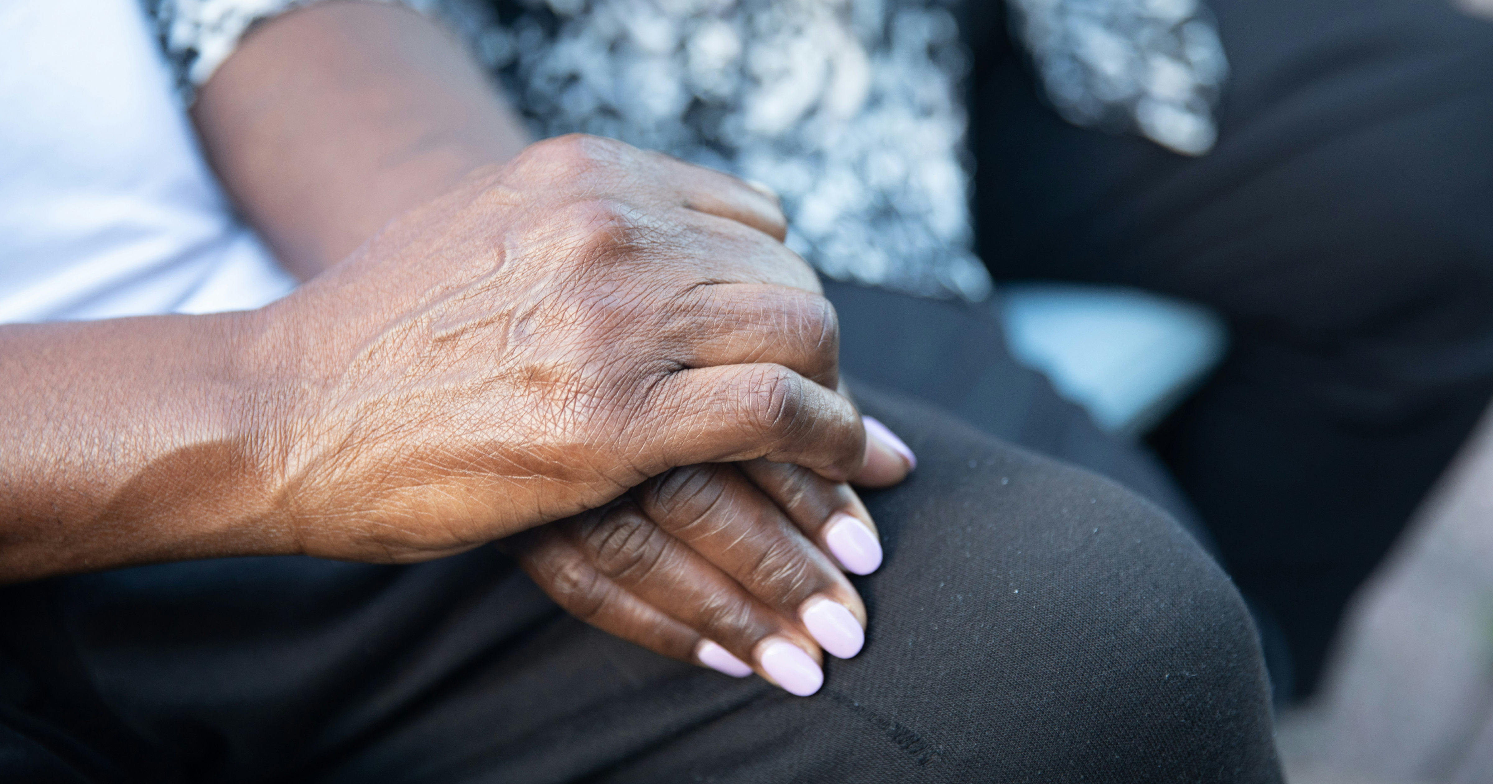 Two elderly hands entertwined by Nappy via Unsplash+