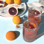 Two cocktails, some ice and some fruit by Alexander Mils via Unsplash