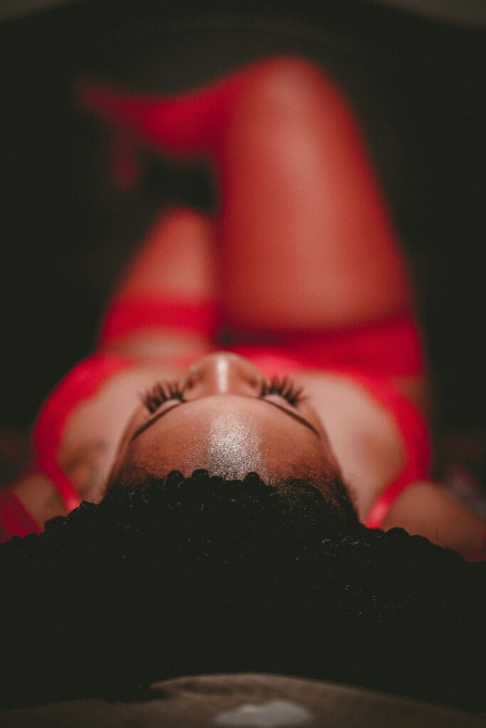 Orgasm: Black women in red lingerie by Tvbeats via Unsplash