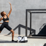A black woman practising yoga by Sunday II Sunday via unsplash