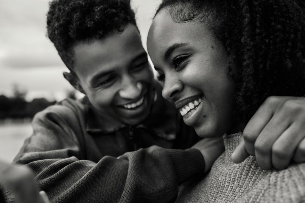 Man and woman smiling together by Edu Bastidas via Unsplash