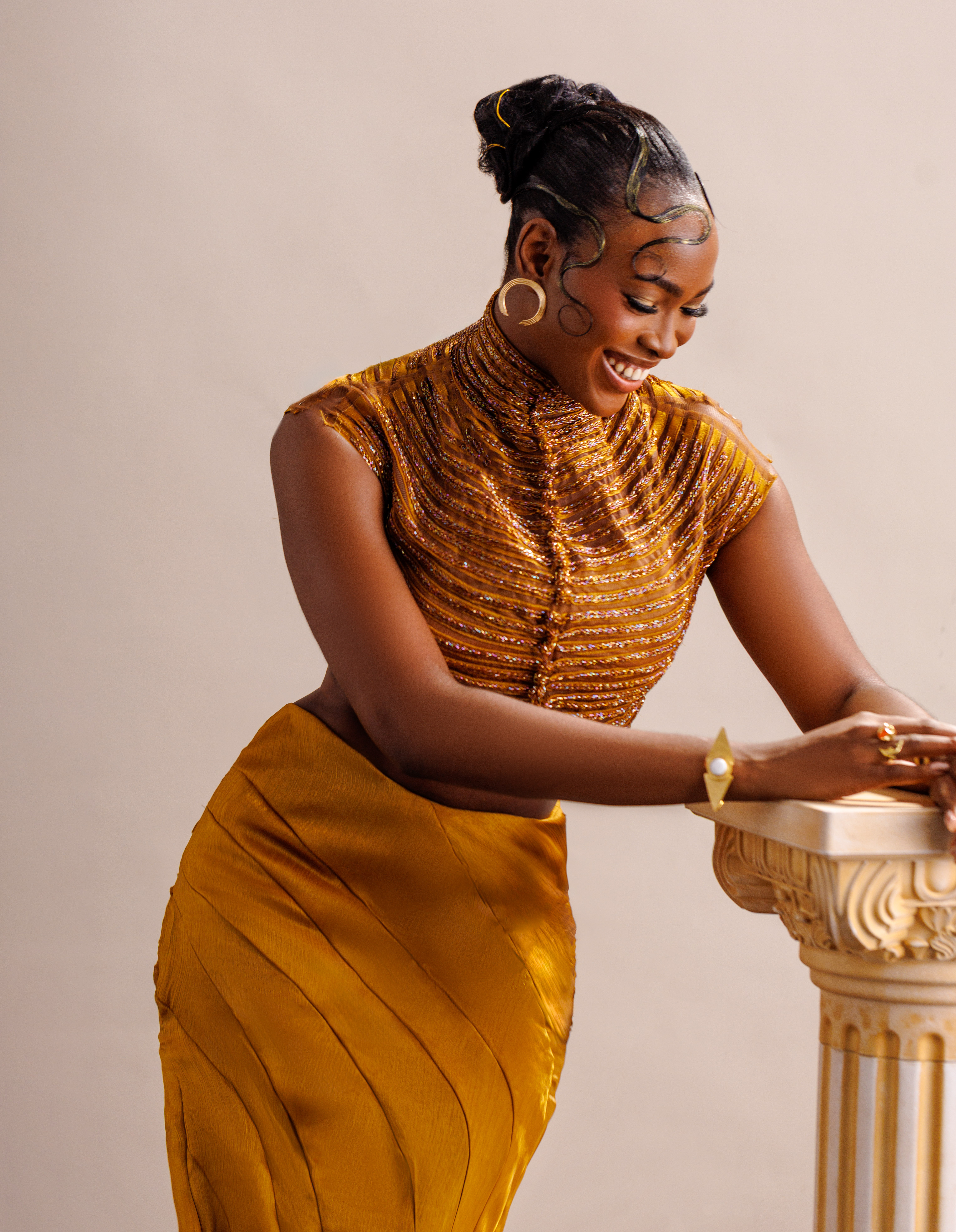 Angel Anosike’s AMVCA debut look in a stunning two-piece set by Yemi Shoyemi. Hair by Bernard Smiles. Makeup by Make up by Tejj. Image by Lasalvy