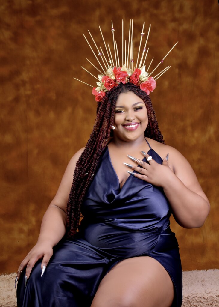 body politics and dysmorphia: Me in 2020, wearing a blue silk gown and elaborate headdress, after gaining 40 kg from prescription medication