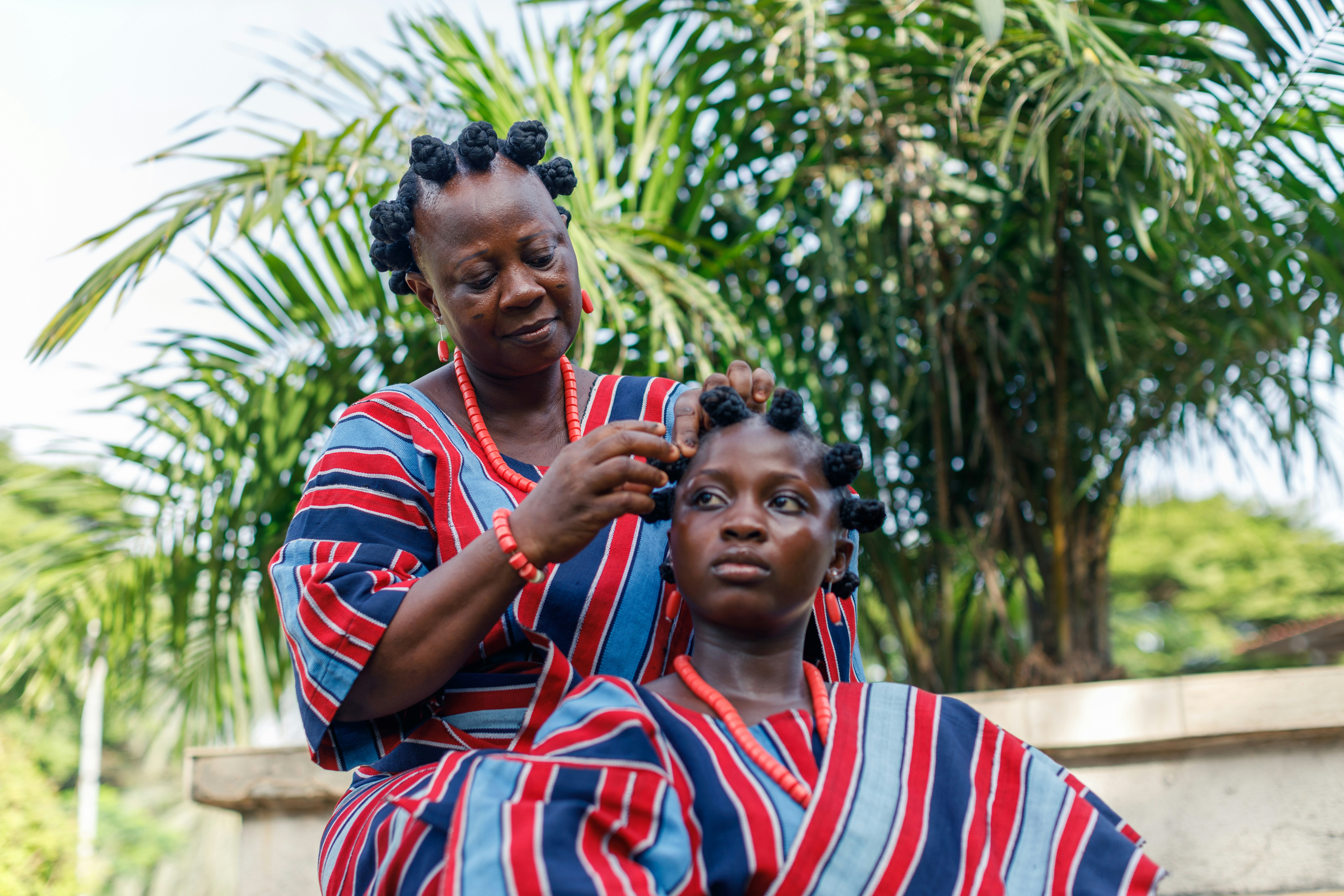 Black mother and daughter with healthy, beautiful hair, by Ben Iwara via Unsplash+