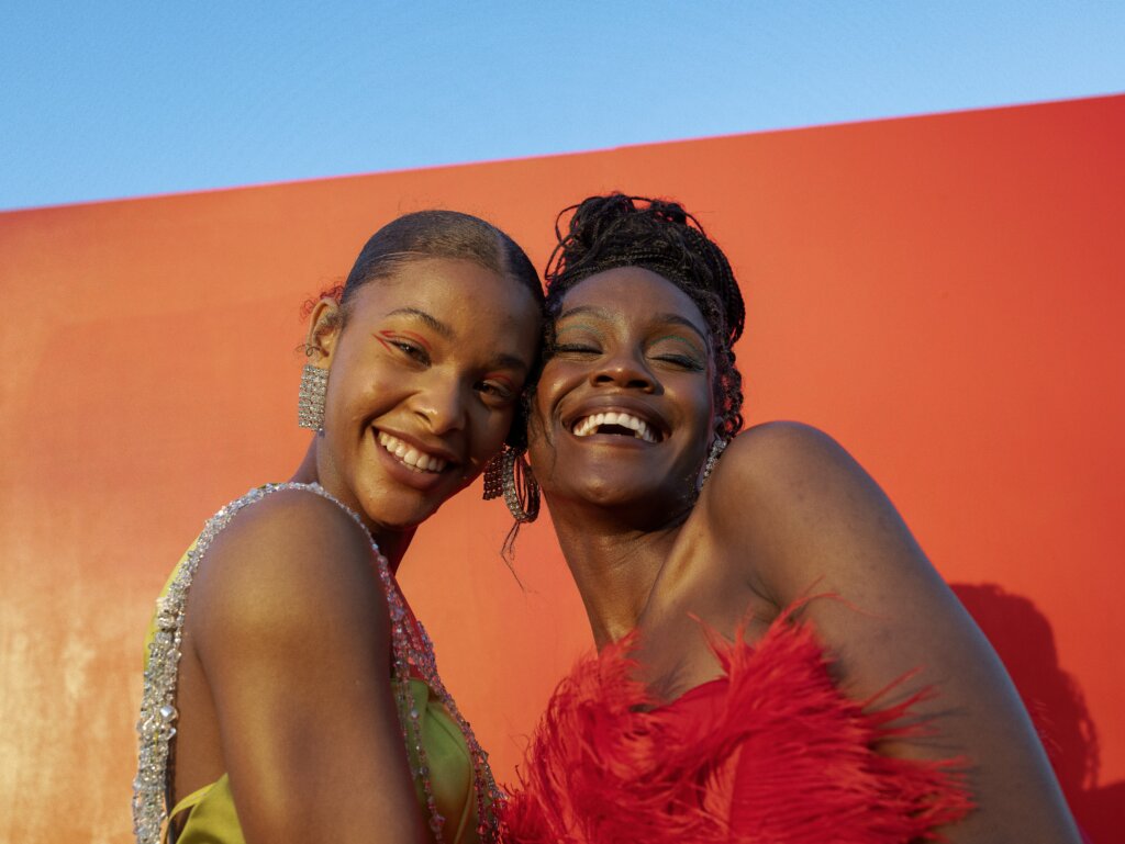 Two black women smiling Oladimeji Odunsin via Unsplash