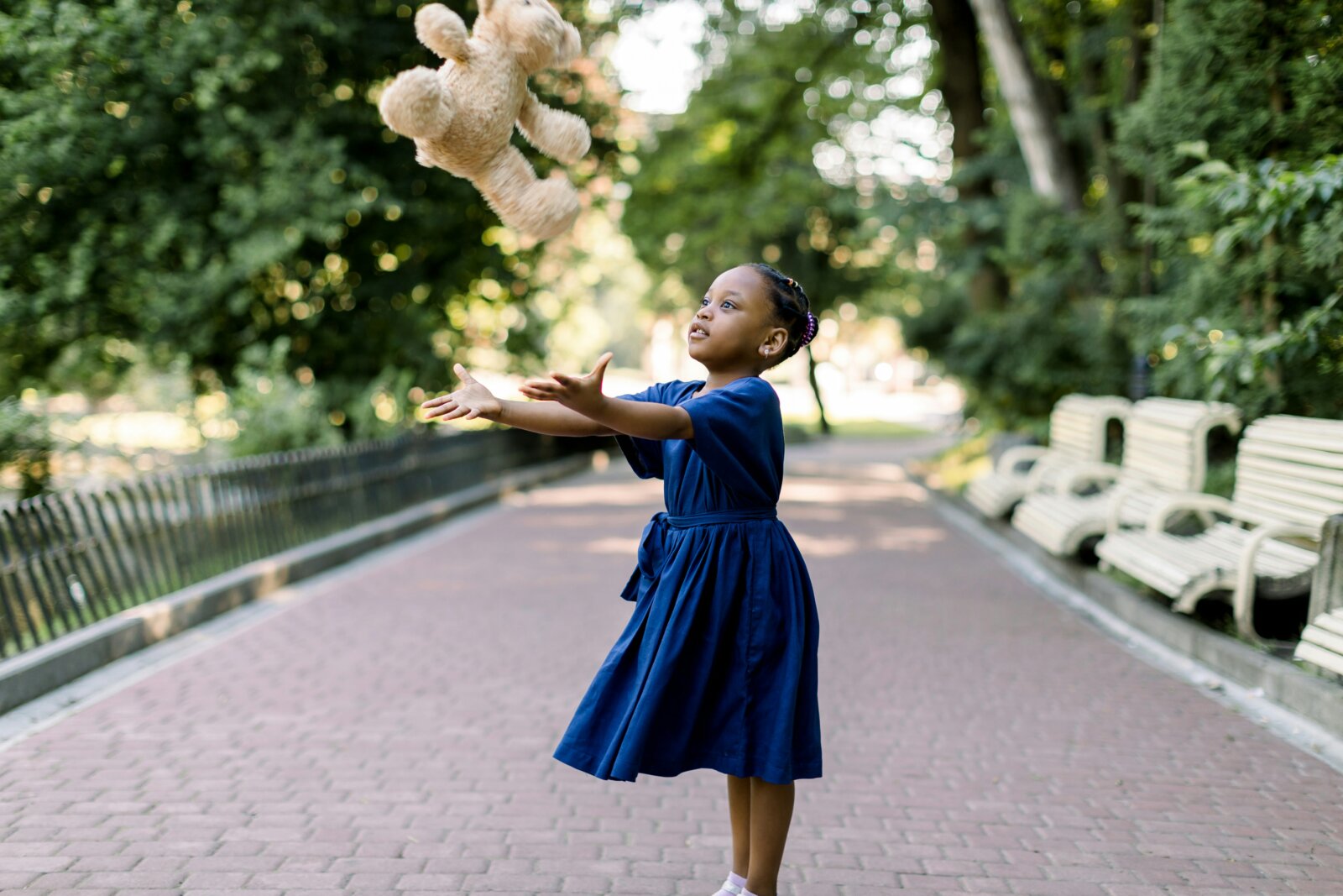 Beauty pressures on children - little girl playing in the park by Getty images via Unsplash 