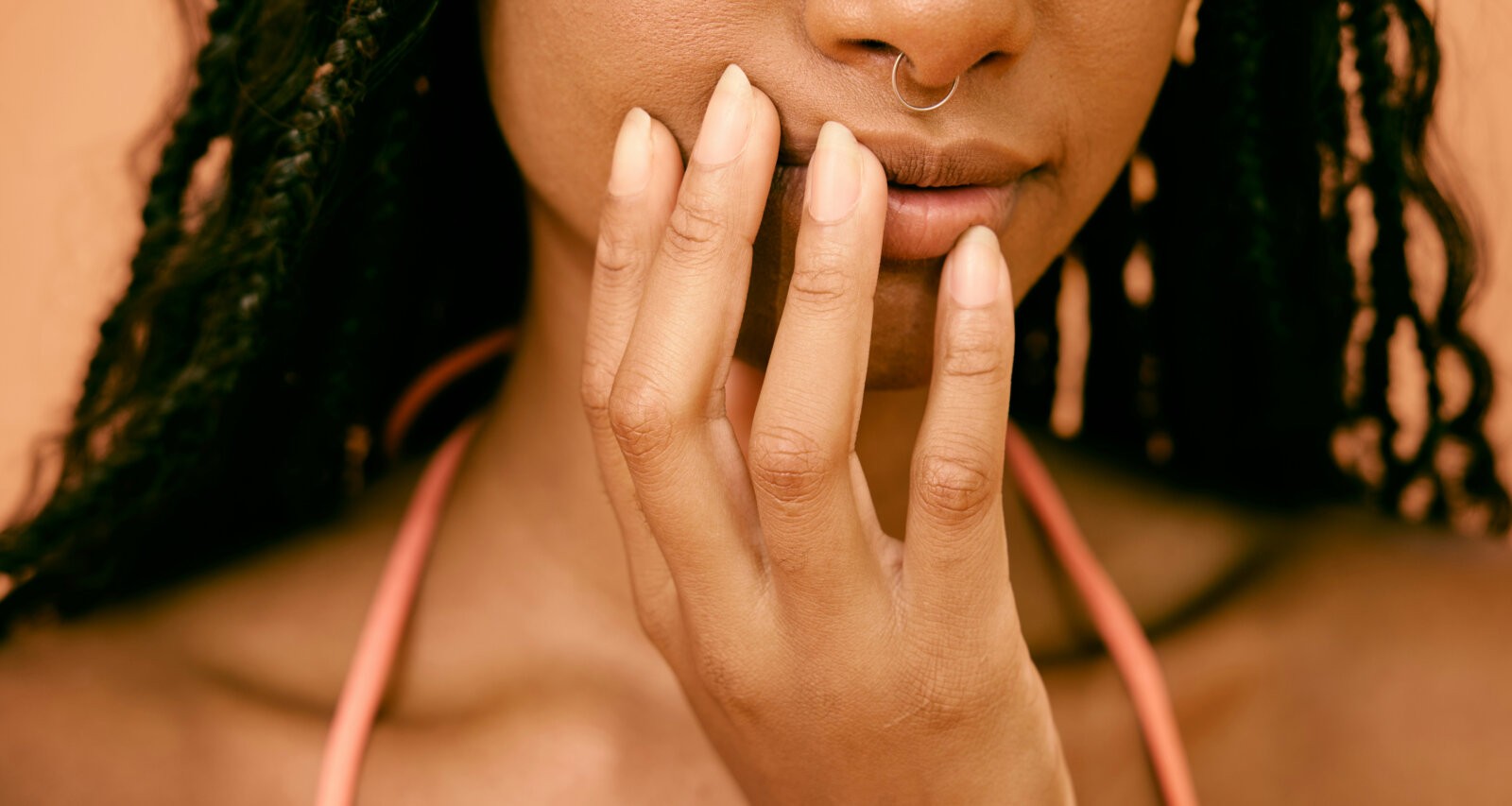 Close up shot of a black woman by Natlia Blauth via Unsplash