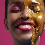 A black woman with honesy running down her face via Freepik