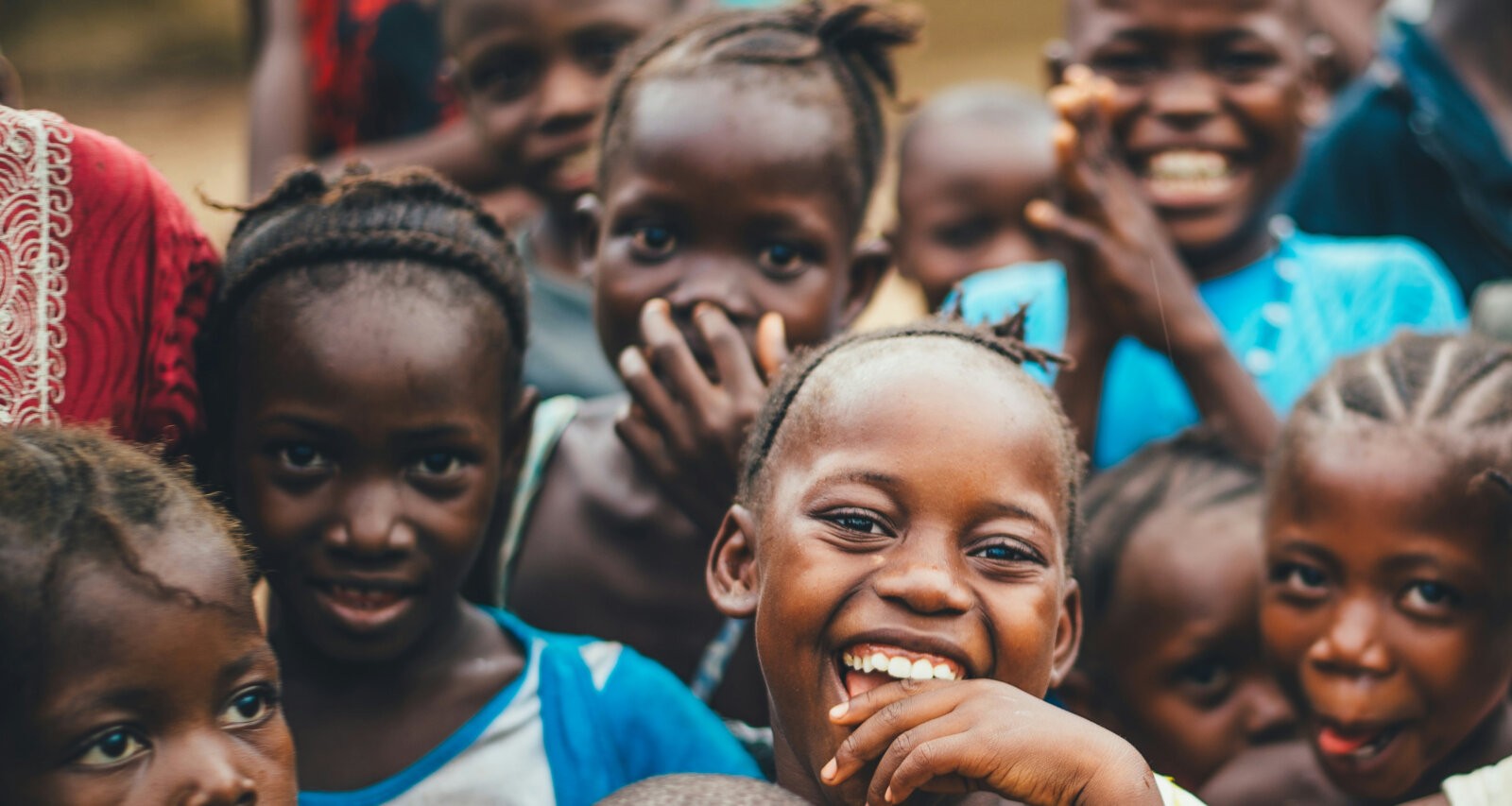 A group of smiling black girls via Unpslash