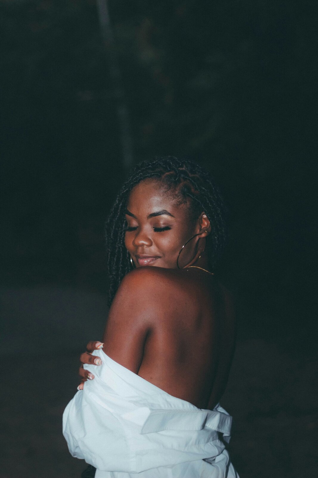 Beauty confession- Beautiful black woman in an oversized white shirt by Jabari Timothy via Unsplash