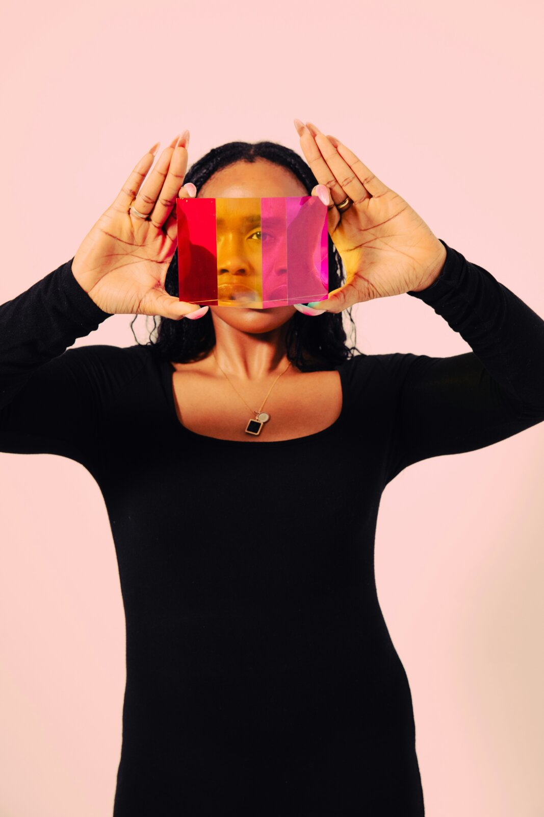 My beauty confessions - cosmetic surgery. Image of woman holding up reflective frame by Nick Fancher via Unsplash