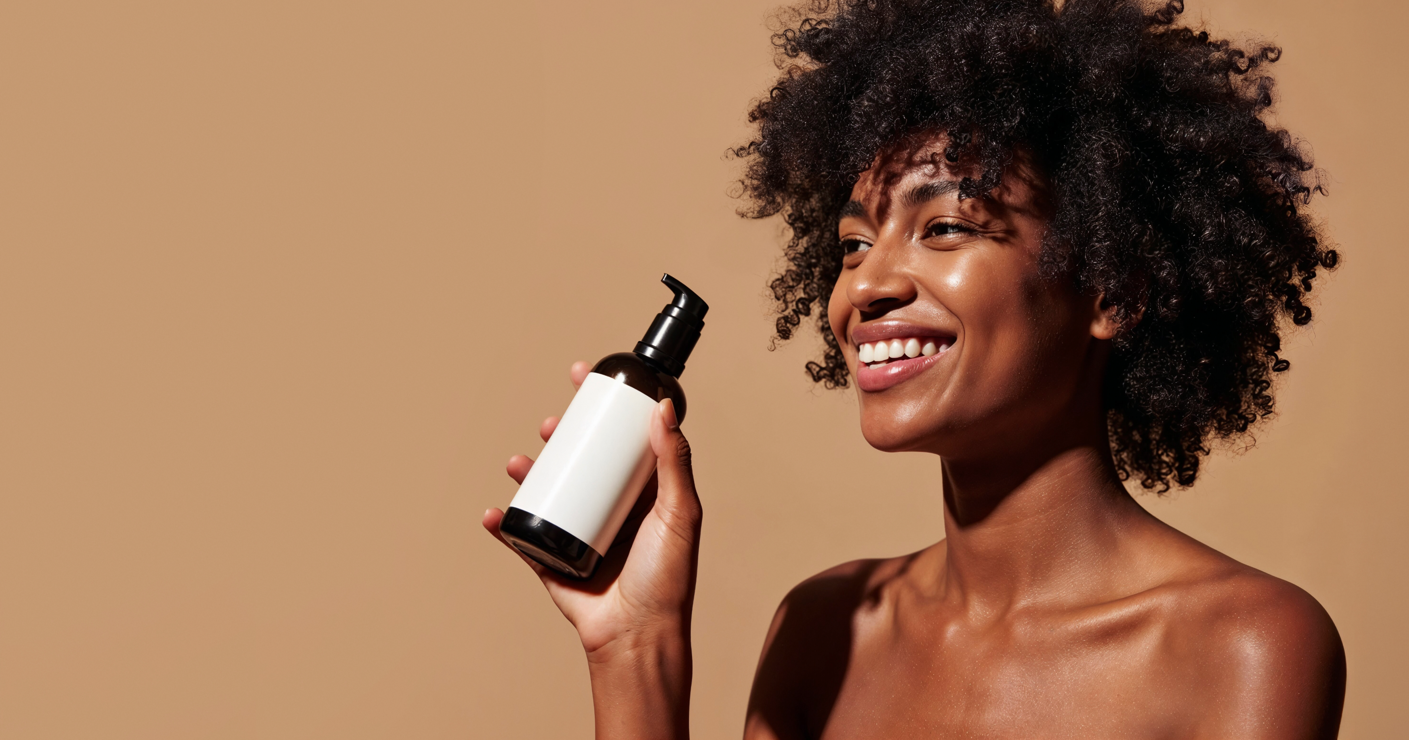 black woman holding a haircare bottle via freepik