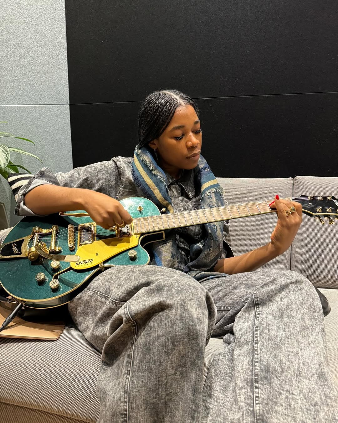 World Music Day; Janet Nwose holding a guitar via @janetnwose on Instagram