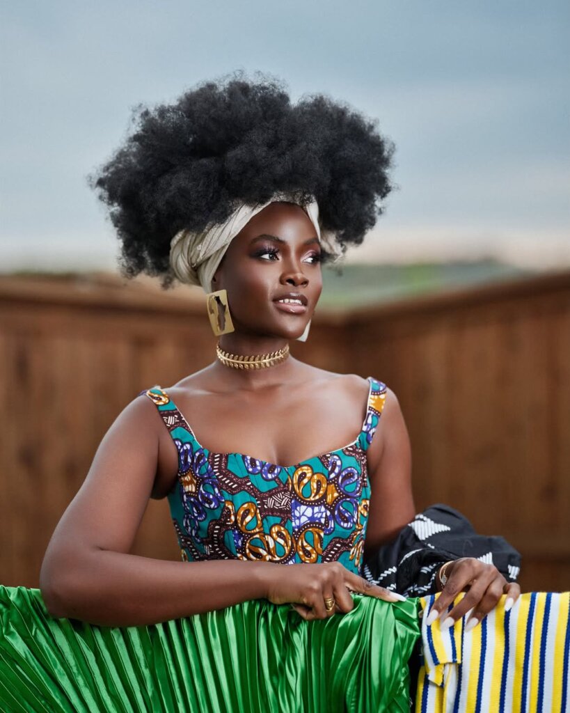 African woman proudly wearing an Afro and African print via @Kristline_ on Instagram