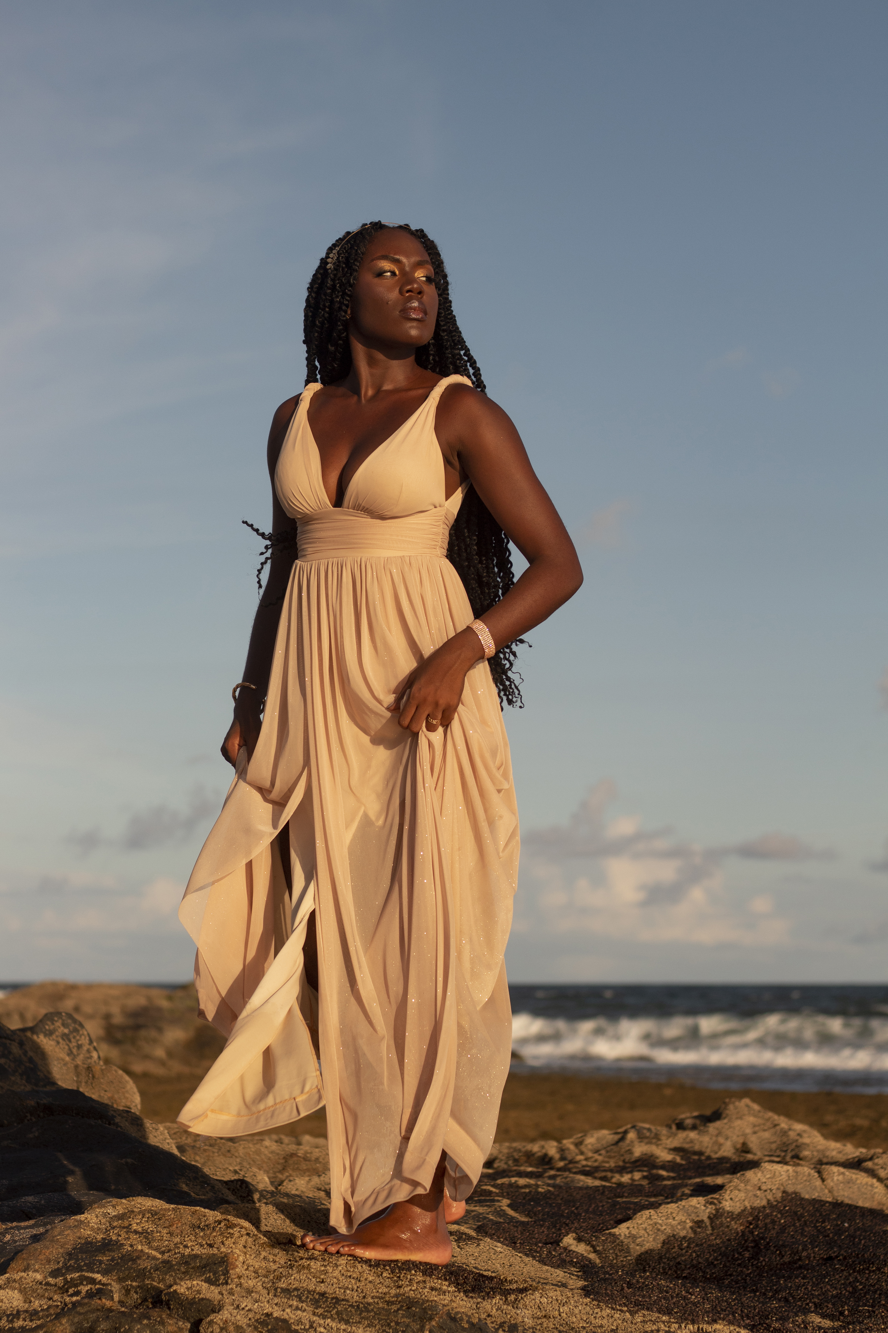 Beautiful black woman in a sundress via Freepik