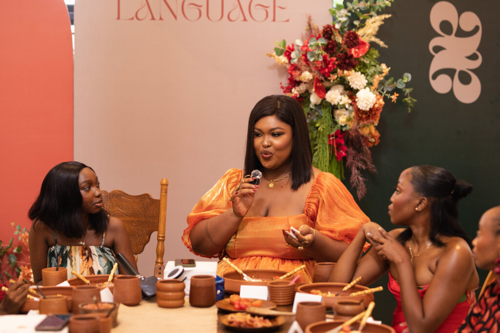 Denise Eseimokumoh speaking to the women of “Beauty in Every Language” at Ajoje via Toyosi Alexis