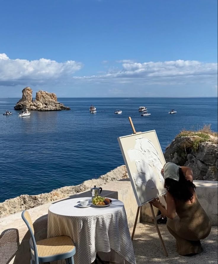 Painter working by the sea via Pinterest (original creator unknown)