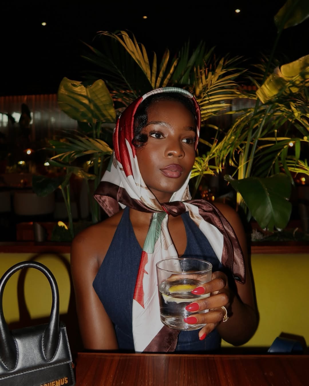 Accessorise like a Lagos babe - Content creator, Ayomide, in a silk headscarf via @ayomidebello on Instagram