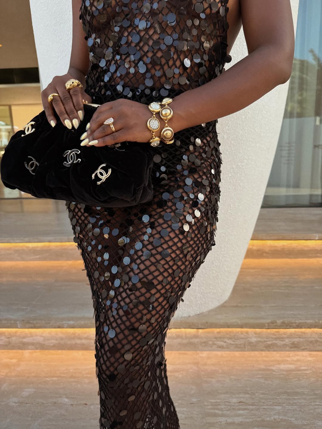 Fisayo Longe in a black Rat & Boa sequin knitted dress via @fisayolonge on Instagram