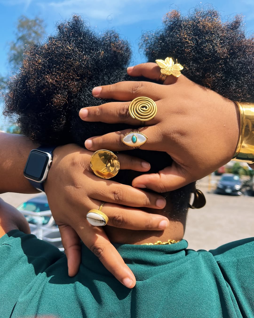  Airport style - Close-up shot of Denise Eseimokumoh's rings via @theloliaba on Instagram.