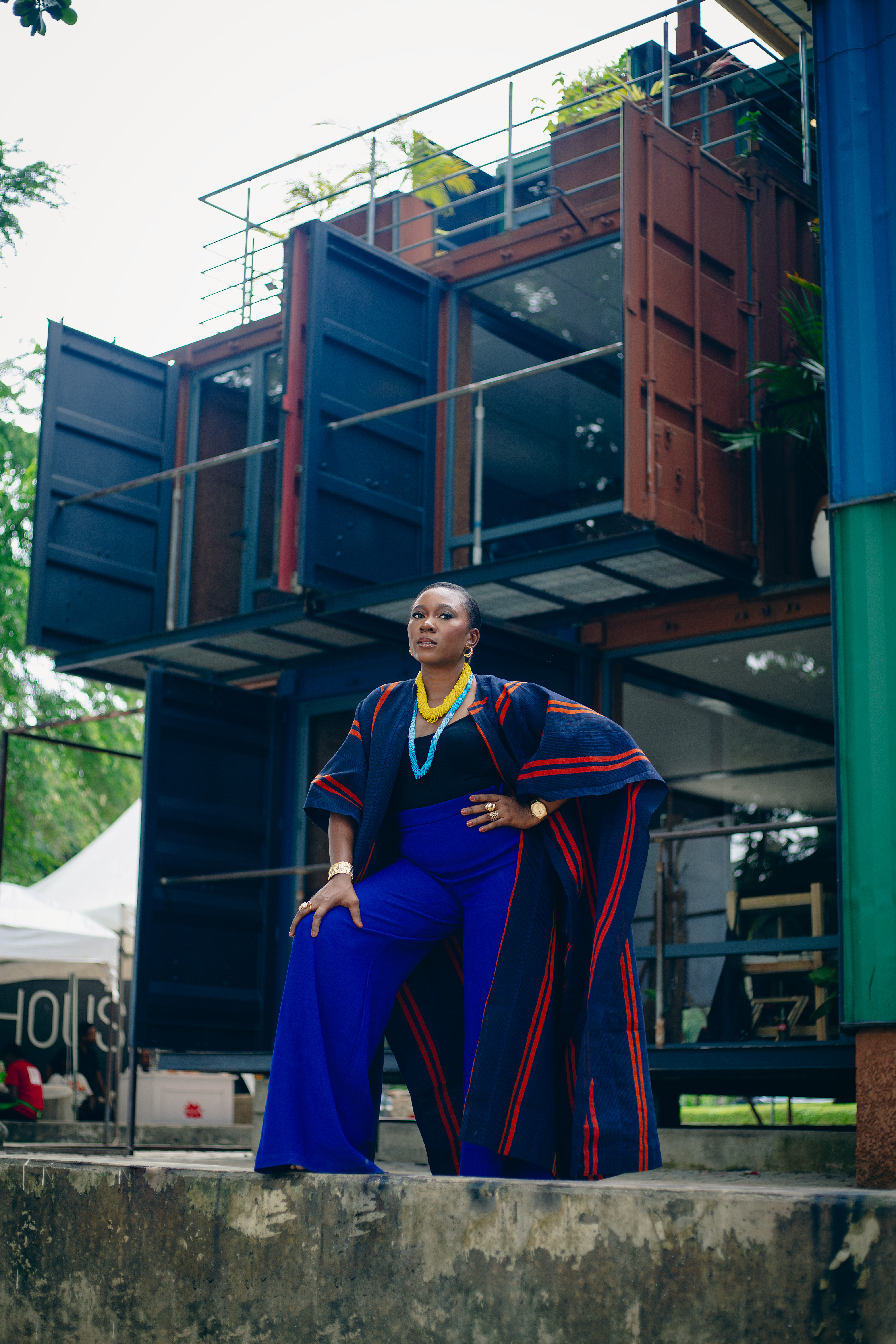 Rhoda Ebun, wearing Ako Africa Kimono Jacket and Tire Studios trousers. Bland 2 Glam accessories.