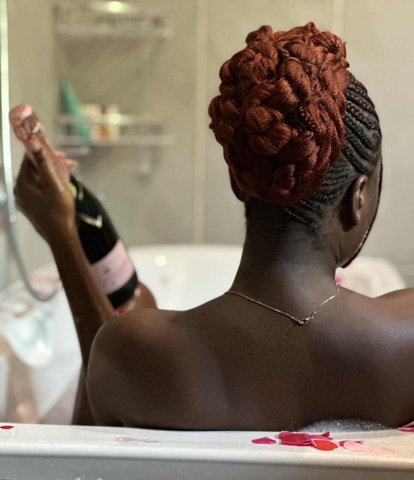 Post-trip skin reset - Wumi Tuase-Fosudo taking a relaxing bath with a bottle of Moët & Chandon champagne via Wumi Tuase-Fosudo