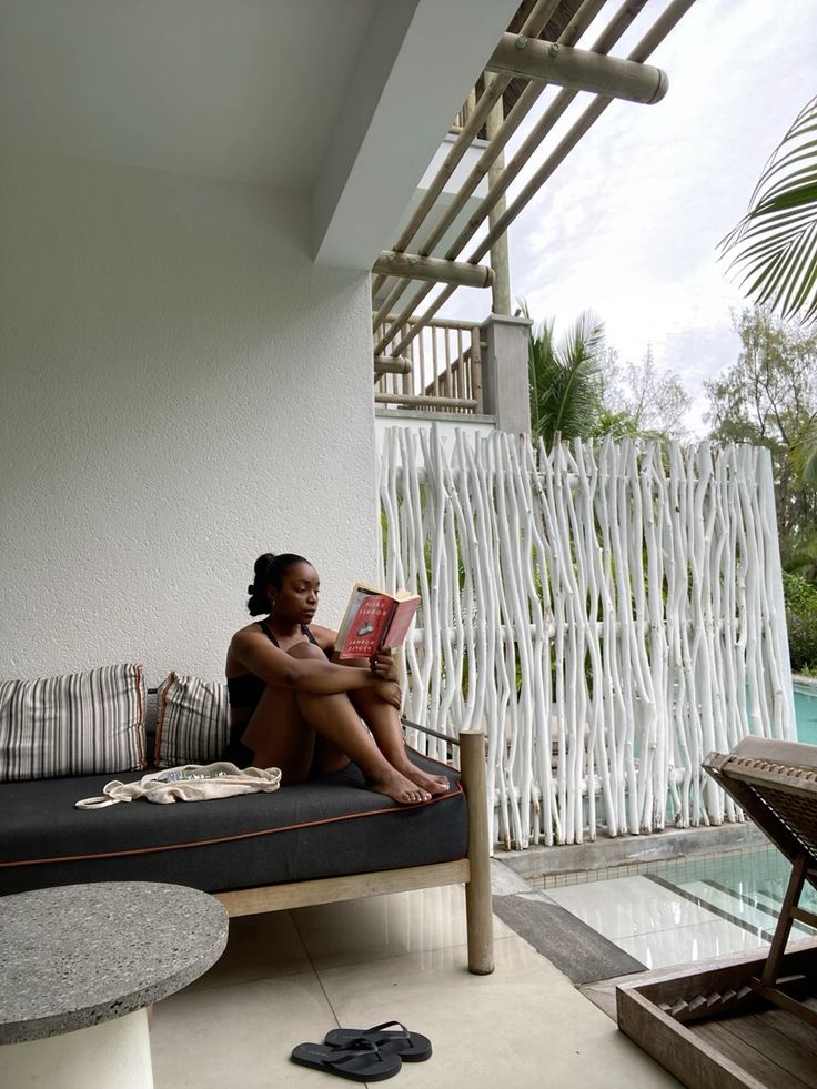 Black woman reading a book by Bridget J via Pinterest