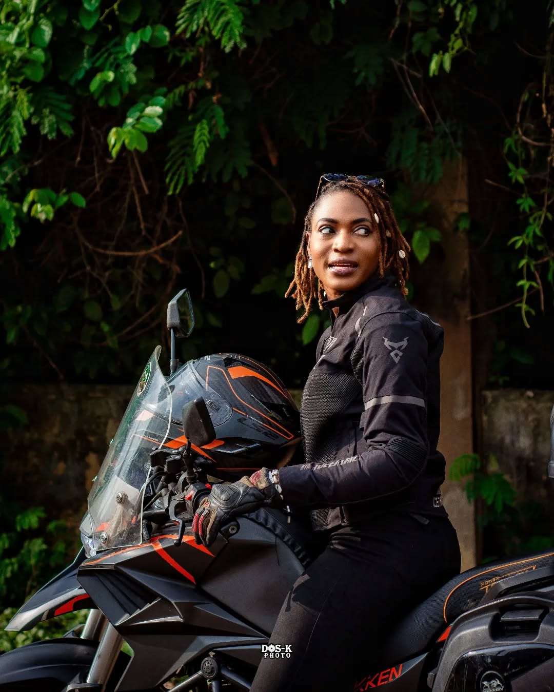 Joy Ebaide, sitting on her motorcycle via @go.ebaide on Instagram