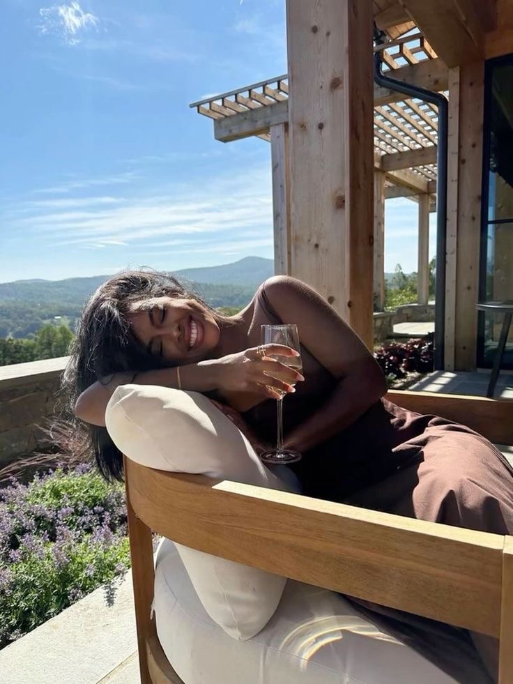 Woman lounging on a chair on a patio via Yas on Pinterest