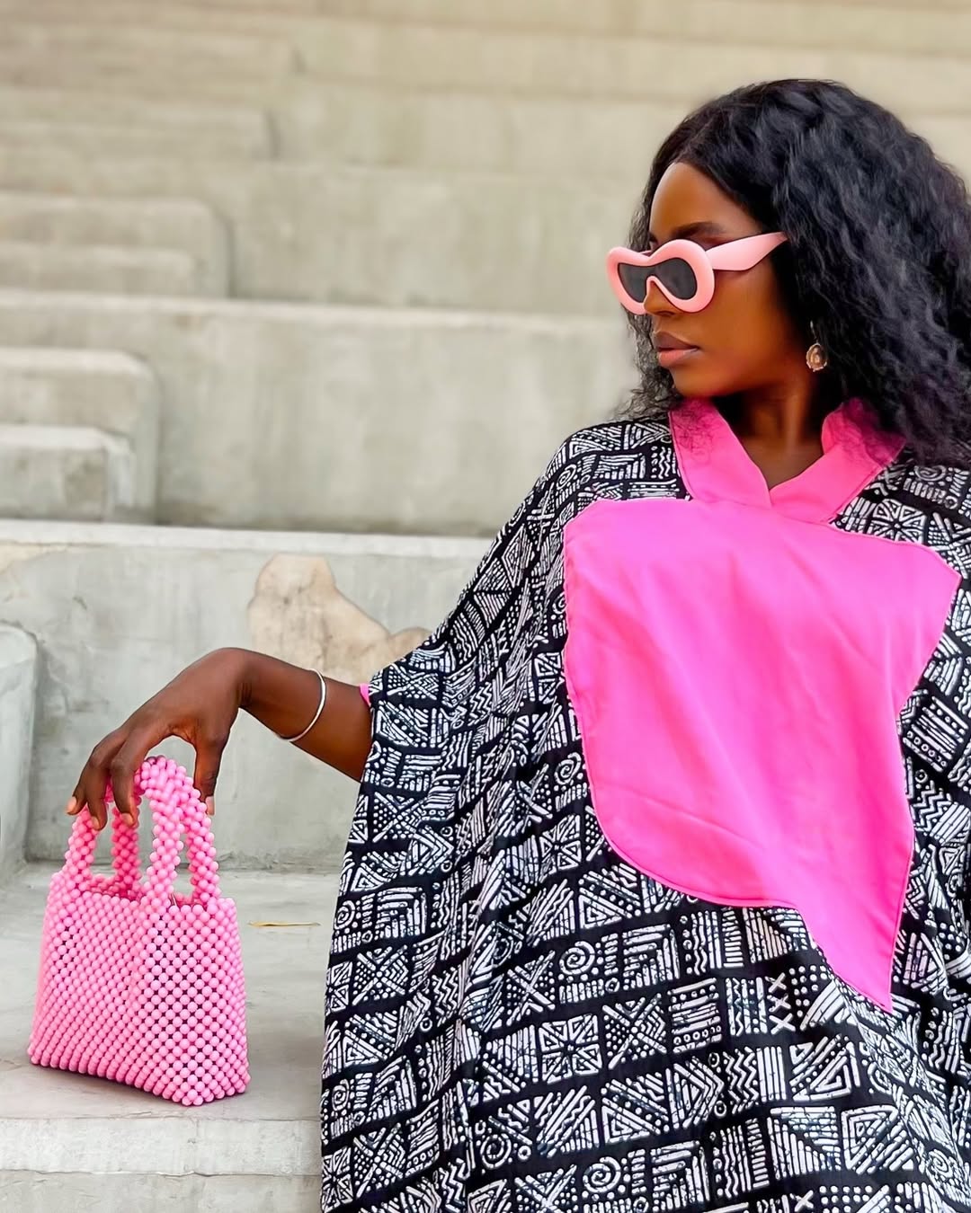 Afrocentric fashion staples - Lade Ibikunle carrying a beaded bag via @ladeibikunle on Instagram