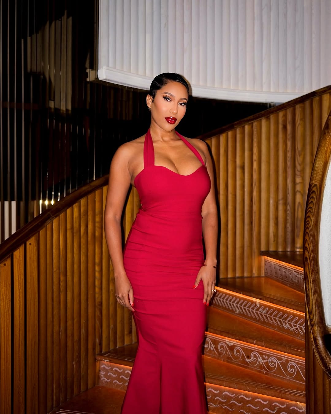 Toni Tone wearing a red bandage dress via @t0nit0ne on Instagram.