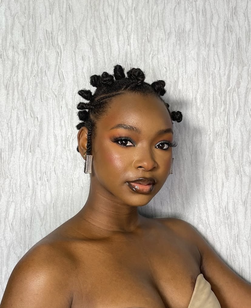 Trendy holiday hairstyles -Naomi shows off her bantu knots via @dk_erica on Instagram.
