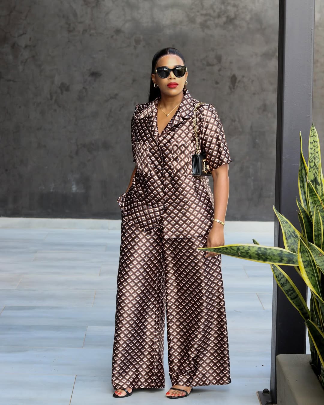 Nthambe wearing a matching silk set by Mukie fashion house @jnthambe633 on Instagram.