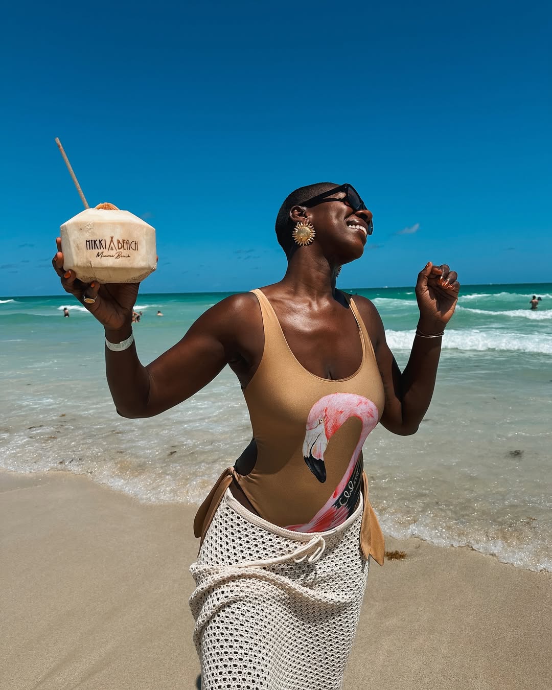  Tashira Halyard soaking up the sun by the beach via @poiliticandfshn on Instagram
